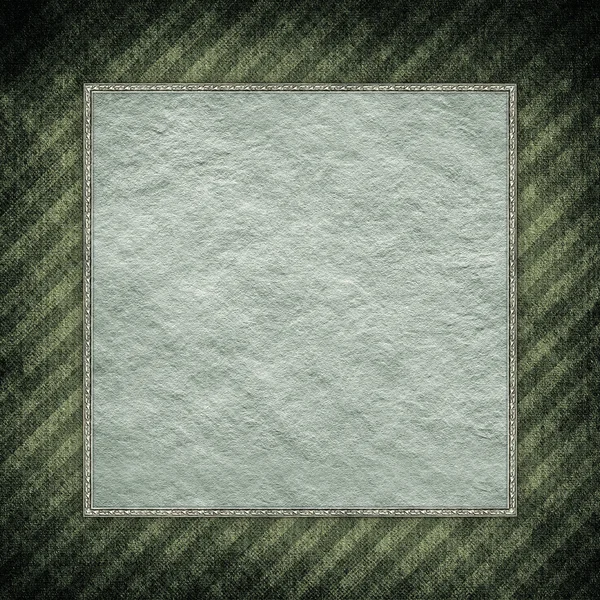 Paper sheet in picture frame on grunge background — Stock Photo, Image