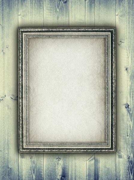 Picture frame on wooden background — Stock Photo, Image