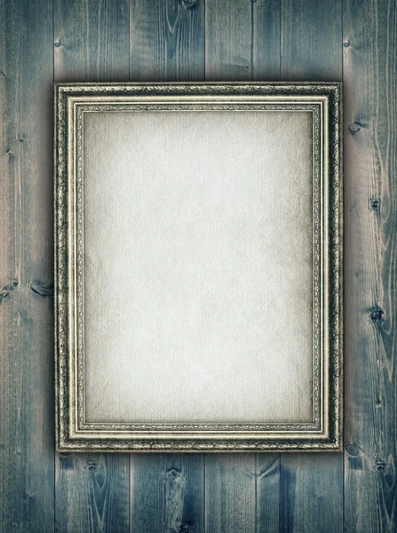 Picture frame on wooden background — Stock Photo, Image