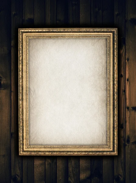 Picture frame on wooden background — Stock Photo, Image