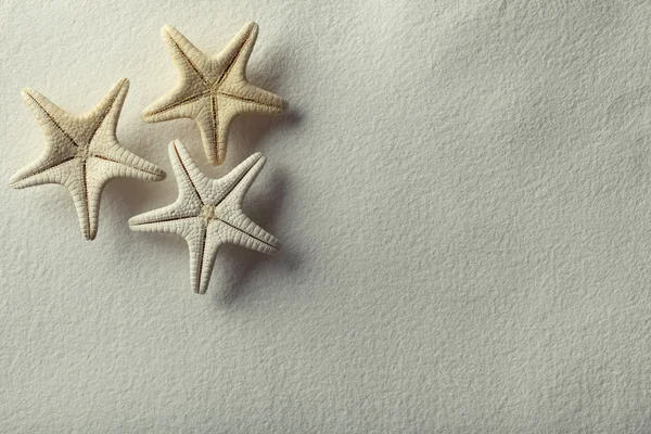 Starfish on handmade paper background — Stock Photo, Image