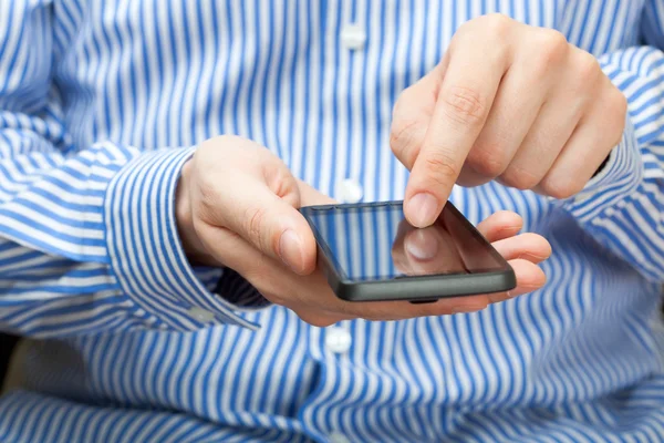 Male finger on smartphone — Stock Photo, Image