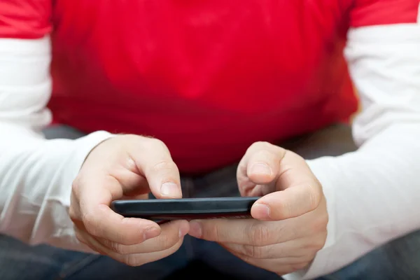 Casual male using smart phone — Stock Photo, Image