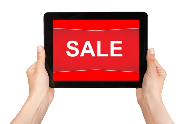Hands holding a tablet with sale on a red screen — Stock Photo, Image