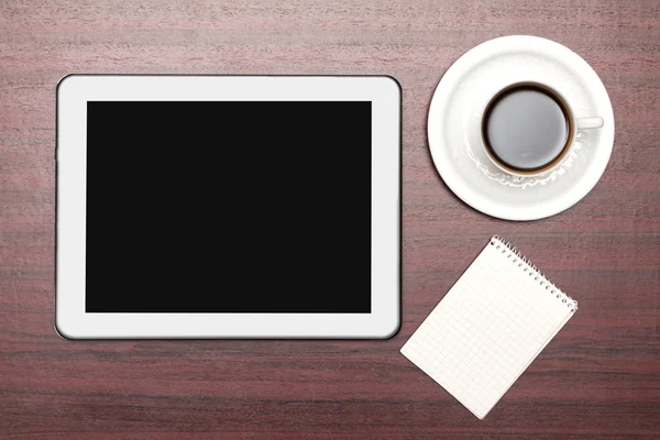 Empty tablet and a cup of coffee in office — Stock Photo, Image