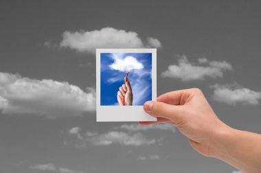 Holding Instant photo. Cloud computing concepts. clipart