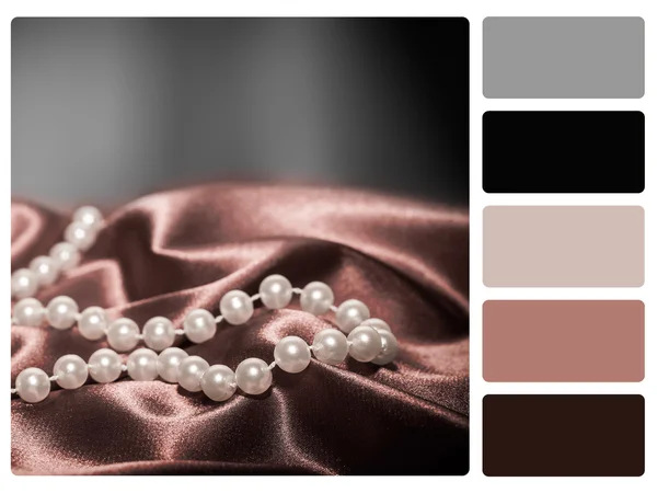 Pearls on a silk colour palette swatch — Stock Photo, Image