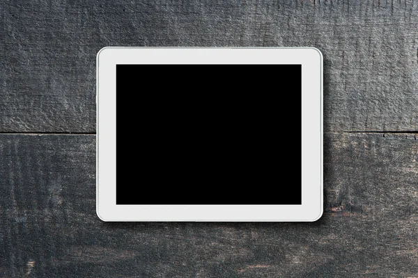 Aanraking tabletcomputer op een achtergrond van hout. — Stockfoto