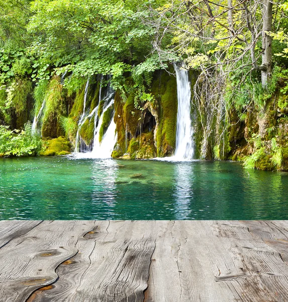 Waterfall and wood pier — Stock Photo, Image