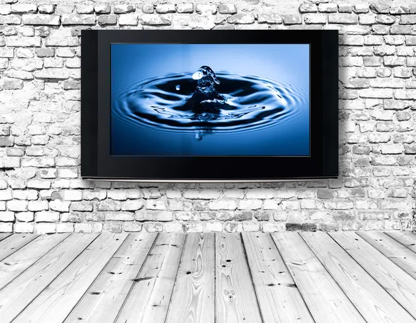 Television set on an old wall — Stock Photo, Image