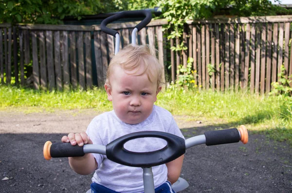 On the tricycle — Stock Photo, Image