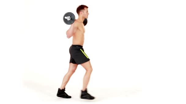 Muscular man lifting weights on isolated white background — Stock Video