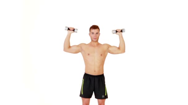 Muscular man exercising with dumbbells on white background — Stock Video