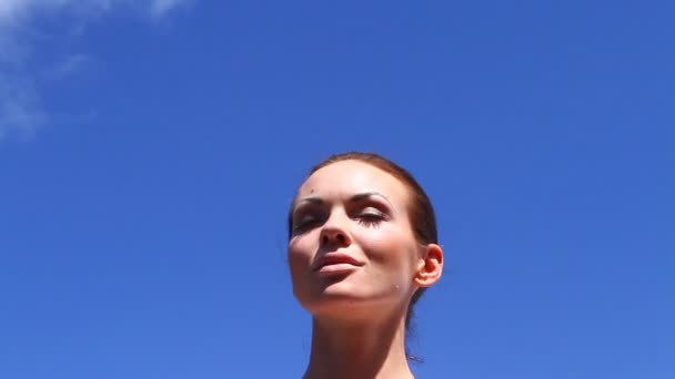 Beautiful woman is taking sun bath — Stock Video