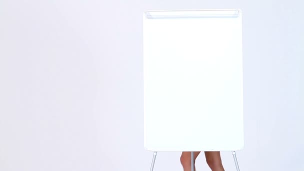 Sexy business woman showing something at blank board — Stock Video