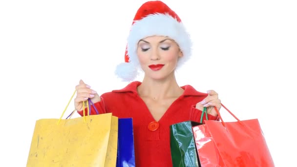 Sexy chica en santa claus sombrero con bolsas de compras — Vídeos de Stock