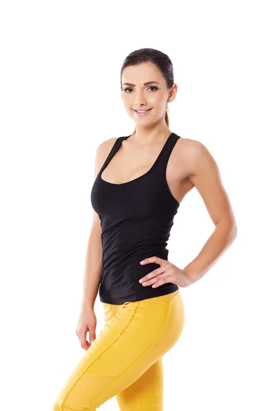 Beautiful sexy woman in yellow gym tights — Stock Photo, Image