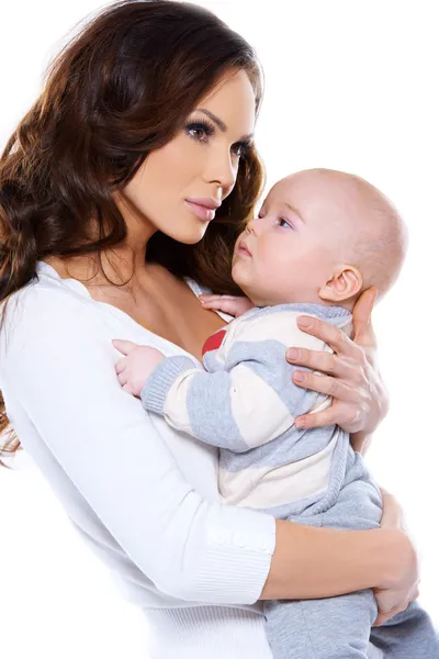 Beautiful mother cradling her little baby — Stockfoto