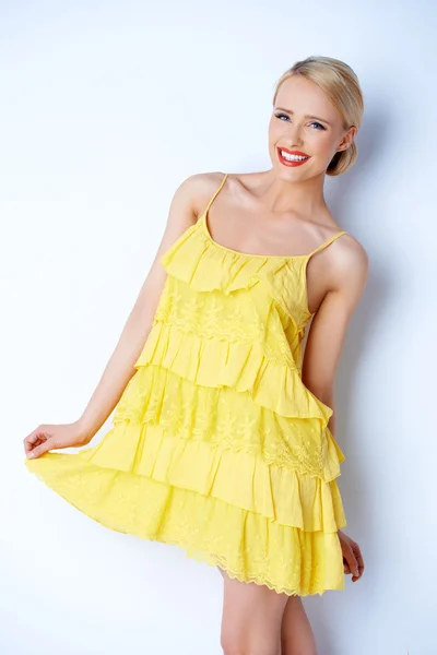 Pretty elegant woman wearing yellow dress — Stock Photo, Image