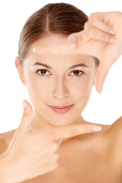 Mujer enmarcando su cara con sus dedos —  Fotos de Stock