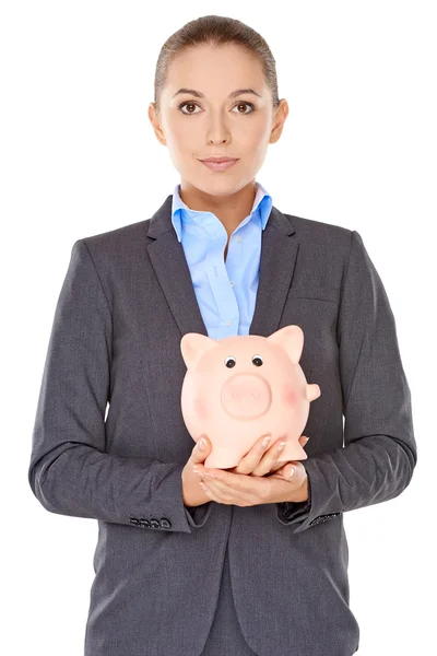 Businesswoman holding a piggy bank — Stock Photo, Image