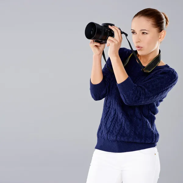 Female photographer assessing her shot — Stock Photo, Image