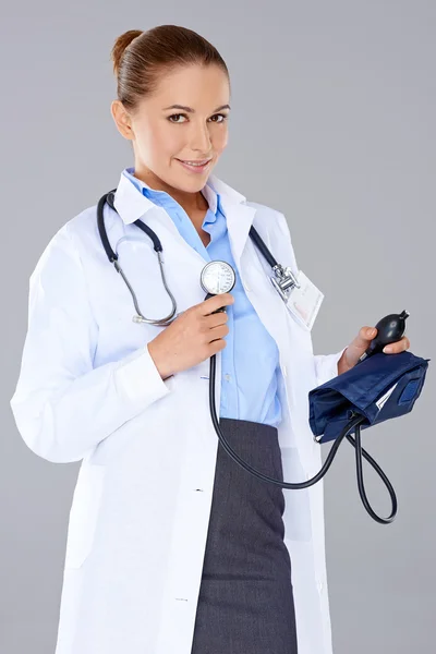 Woman doctor with a sphygmomanometer — Stock Photo, Image