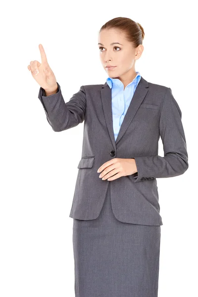 Businesswoman pointing and looking up — Stock Photo, Image