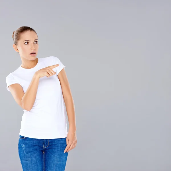 Woman pointing in disbelief — Stock Photo, Image