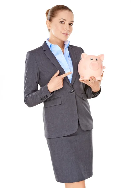 Businesswoman holding a piggy bank — Stock Photo, Image