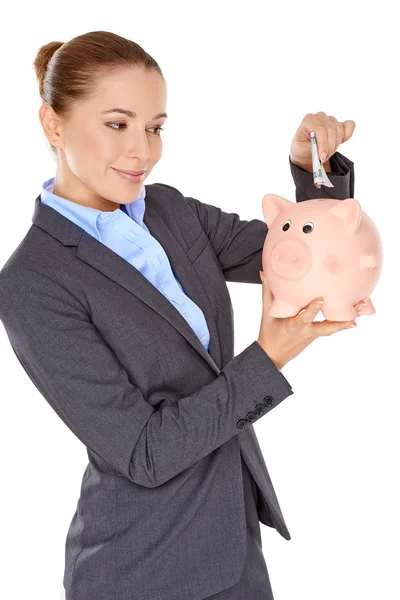 Empresária de sucesso com um banco porquinho — Fotografia de Stock