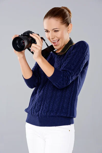 Female photographer assessing her shot — Stock Photo, Image