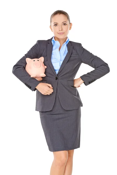 Businesswoman with a piggy bank — Stock Photo, Image