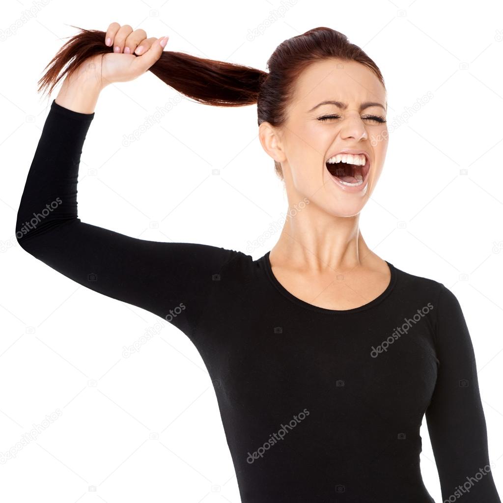 Woman fed up with long hair screaming — Stock Photo © dashek #32667445, image size:1024x1024