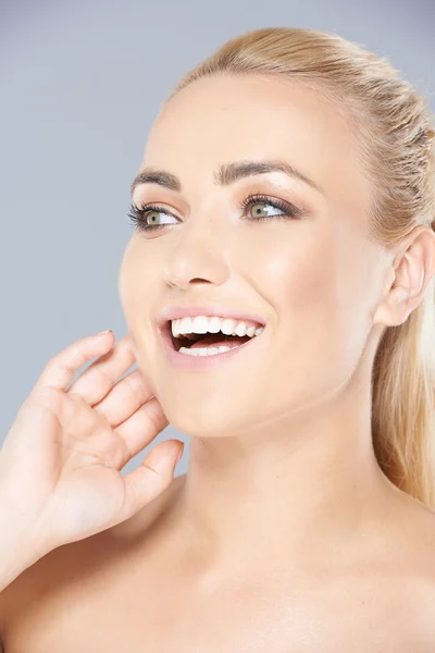 Beautiful young blond girl laughing — Stock Photo, Image