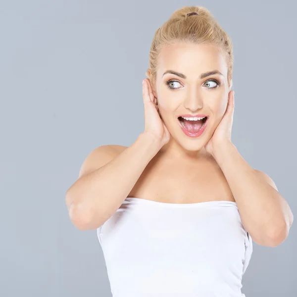 Excited woman with an expression of amazement — Stock Photo, Image