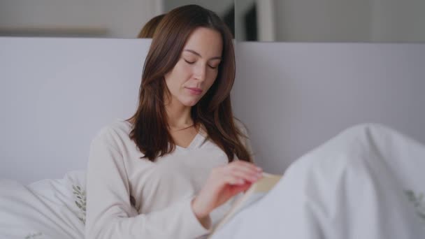 Female reading book in morning — Stock Video