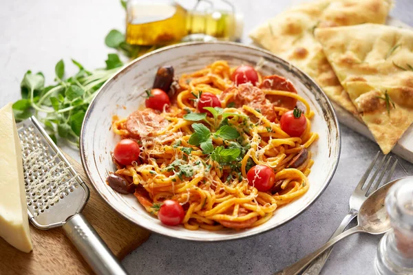 Tasty appetizing pasta served with tomato sauce — Photo