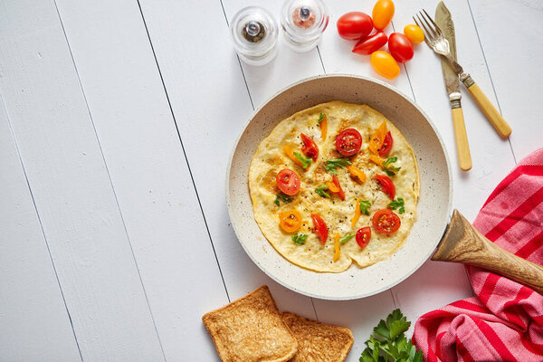 Tasty homemade classic omelet with cherry tomatoes Royalty Free Stock Images