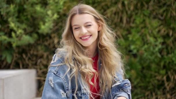 Happy Young Female Denim Jacket Smiling Looking Camera While Resting — Stockvideo