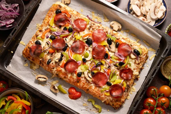 Delicious Homemade Rectangular Pepperoni Pizza Rustic Table Ingredients Top View — Stockfoto