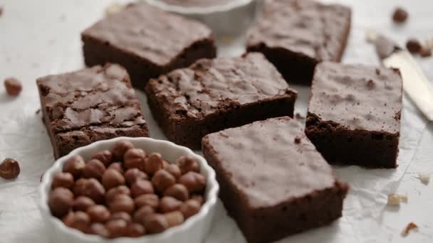Fresh Homemade Chocolate Brownie Served Hazelnuts Melted Cream Baking Paper — Αρχείο Βίντεο