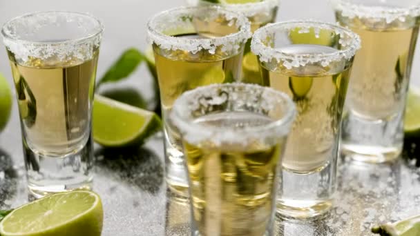 Golden Tequila Shots Served Lime Sea Salt Table Flat Lay — Vídeo de stock