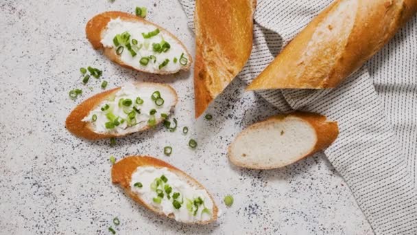 Fresh Delicious Crispy Baguette Cream Cheese Chives Served Stone Table — Stockvideo