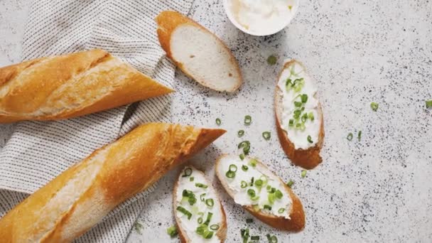 Fresh Delicious Crispy Baguette Cream Cheese Chives Served Stone Table — Stockvideo