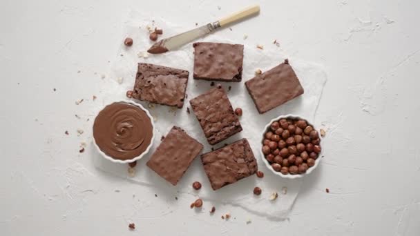 Fresh Homemade Chocolate Brownie Served Hazelnuts Melted Cream Baking Paper — Αρχείο Βίντεο