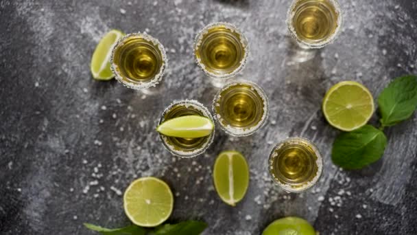 Top View Golden Tequila Shots Served Lime Sea Salt Table — ストック動画