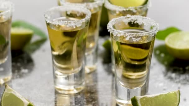 Golden Tequila Shots Served Lime Sea Salt Table Flat Lay — Stok Video