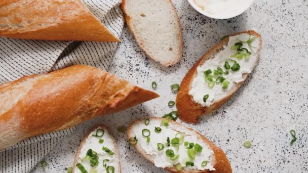 Fresh Delicious Crispy Baguette Cream Cheese Chives Served Stone Table — Vídeo de Stock