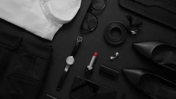 Business woman styling objects set on black background, Top view. Flat lay concept